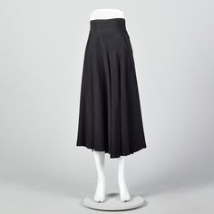 "This listing is for one skirt. Textile is unmarked. Full skirt with pleated waistband. This is a very lovely black skirt with a nice sweep. Beautiful drape and movement. Wide waistband with horizontal pleats. Left side zip with button and loop closures at the waistband. Size Marked: Unmarked Approximate Size: Medium **Please Check Measurements to be Sure! Fabric: Unmarked Lining Type: None Closure: Zip Label: Unmarked Condition: Excellent Era: 1950s Inventory#: DSC1018-1984 Measurements- Waist: High Waist Pleated Evening Skirt, Fitted Box Pleat Pleated Skirt For Evening, Classic Full Skirt Bottoms With Accordion Pleats, Classic Full Skirt With Accordion Pleats, Pleated Flared Skirt For Evening, Fitted Long Skirt With Box Pleat, Black Full Skirt Bottoms For Daywear, Vintage Flared Formal Skirt, Vintage Flared Skirt For Formal Occasions