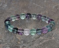 *Fluorite Beaded Bracelet* IMPORTANT: ♥ Fluorite is considered to be one of most popular minerals in the world among gem and mineral collectors, second only to quartz. It is often referred to as the most colorful mineral in the world owing to its variety of brilliant colors. Many people believe Fluorite has a calming effect on the body. ♥ When your select your size (from the drop-down box) let me know the exact measure of your wrist without adding extra length please. I will do it and you will g Fluorite Stone, Chakra Bracelet, Rainbow Fluorite, Nature Bracelets, Gems And Minerals, Brilliant Colors, Bracelet Stack, Bracelet Gift, Crystal Healing