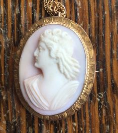 "Antique 10K Gold Victorian Pink Angel Skin Coral 3D Cameo Engraved Necklace 18\" Offered here is an antique 10k gold Victorian oval pink angel skin coral 3D cameo filigree necklace measuring; 18\" long. The engraved work & setting are just breath taking! The cameo measure 1.5\" high x 1 1/8\" wide. This piece is stamped 10K. Necklace closes securely with a jump ring. The chain is gold filled. Marked 1/20 12K. In nice, sturdy, excellent condition showing few signs of wear. Weighs; 3.6dwt or Antique Pink Cameo Jewelry, Pink Cameo Jewelry For Formal Occasions, Antique Pink Collectible Jewelry, Collectible Pink Pendant Jewelry, Antique Jewelry Victorian, Ruby Necklace Pendant, Angel Skin, Pink Angel, Carnelian Jewelry