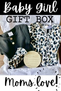 the baby girl gift box is packed with clothes and accessories