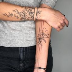 two people with tattoos on their arms and one has a flower tattoo on the arm