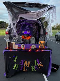 the trunk of a car decorated for halloween