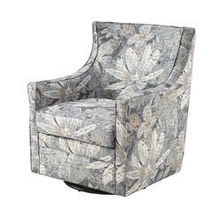 an upholstered chair with a floral pattern on the back and arms, sitting in front of a white background