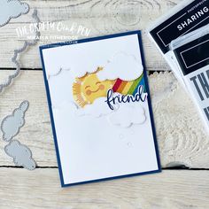 a card with the word friend on it next to some scissors and other crafting supplies