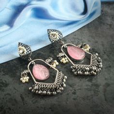 Designer replica earrings, a silver metal alloy which is known for its silver like appearance and excellent antique oxidized finish, It is ethnic designer earrings. This piece goes well with Indian outfits!! A piece to definitely win compliments!! Memorable gift for weddings and special occasions. Description  Item Code:- L9960 Black Oxidized Plated Pink Carved Flower Earrings  Measures- 95x45mm approx Quantity- One Pair Note: This is crafted as a replica of silver and may have slight irregularities as it is crafted by hand.The product shipped will be same as shown in the picture however, actual colors may vary slightly from those shown due to the nature of photographing and monitor color settings. Please see more different designs here:- https://www.etsy.com/in-en/shop/LUCKYJEWELSART?ref= Replica Earrings, Pearl Earrings Designs, Replica Jewelry, Designer Replica, Earrings Pink, Memorable Gifts, Chandelier Earrings, Indian Outfits, Designer Earrings