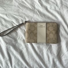 Tan Coach Wristlet With Inside Card Wallet Holder. New With Tags Inside. Never Used. Chic Beige Bags With Wrist Strap, Beige Clutch With Wrist Strap For Gift, Beige Clutch With Wrist Strap As Gift, Coach Clutch For Daily Use, Beige Wristlet Clutch With Removable Pouch, Beige Rectangular Clutch With Wrist Strap, Coach Beige Wallet With Removable Pouch, Coach Beige Coin Purse For Daily Use, Coach Beige Pouch Wristlet