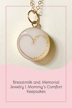 a necklace with a heart on it and the words breastmik and memorial jewelry mommy's comfort keeps