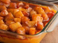 sweet potato and apple casserole in a glass dish with the words, sweet potato and apple casserole