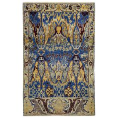 This Blue Alchemy Contemporary Wool Rug - 4'2" x 6'7" showcases a symmetrical design in shades of blue, beige, and hints of brown. The intricate floral and botanical motifs, along with geometrical elements, are richly decorated on this hand-knotted piece from India. Crafted with high attention to detail, this contemporary rug is a true work of art, perfect for adding a touch of luxury to any space. Botanical Motifs, Symmetrical Design, Alchemy, Shades Of Blue, Contemporary Rug, Wool Rug, Hand Knotted, Shades, Rug