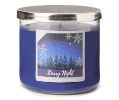 a blue candle with snowflakes on it and the words starr night written in silver