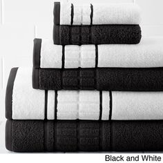 black and white towels stacked on top of each other