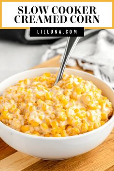 a white bowl filled with corn on top of a wooden cutting board