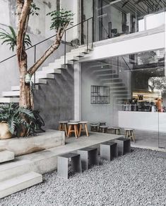 an indoor area with concrete steps and plants