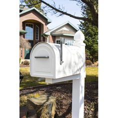 a white mailbox in front of a house