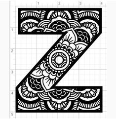 the letter z is made up of black and white lace with an intricate design on it