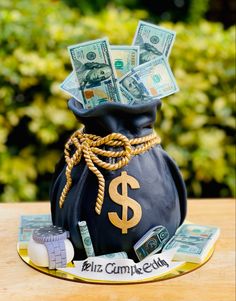 a black bag with money in it sitting on top of a table