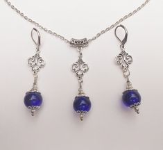 Victorian Silver Cobalt blue jewelry set Blue set necklace earrings Boho jewelry set Bohemian set Silver pendant  set Vintage style set gift Silver-toned fine ornaments and Cobalt blue Murano glass beads Victorian jewelry set necklace and earrings. Bohemian necklace and earrings . Beautiful Set of silver-tone Antique style Cobalt Blue necklace and earrings. Silver tone pendant Victorian style necklace and earrings. Boho necklace. Bohemian necklace and earrings. Romantic necklace and earrings. Beautiful necklace with same style earrings with Royal blue Murano glass handmade beads.  Perfect Gift for girlfriend, mother, sister, bridesmaids or Maid of honor. Gift for special people or jewelry set for your special occasion. FREE SHIPPING  Material: silver toned metal ornaments ,blue glass beads Blue Metal Jewelry Sets, Blue Jewelry Sets With Matching Round Earrings, Blue Metal Jewelry Sets As A Gift, Blue Pendant Necklace With Matching Earrings, Nickel Free Blue Jewelry Sets, Royal Blue Pendant Jewelry As Gift, Royal Blue Pendant Jewelry For Gifts, Royal Blue Pendant Jewelry Gift, Bohemian Sapphire Pendant Jewelry