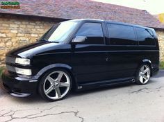 a black van parked in front of a building