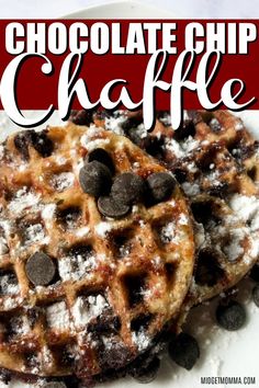 two chocolate chip waffles on a plate with powdered sugar and chocolate chips