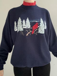 Vintage preloved double collar crew neck sweatshirt.  Blue sweatshirt with embroidered red cardinal detail and printed snow covered pine tress.  Second crew neck collar in red detail. Pleasant Shade Brand, made in the USA Tagged Size XL.  See below for detailed measurements: Measurements (all measurements taken lying flat): pit to pit: 24.5" length (back base of neck to bottom hem) "27 sleeve length: 24" All preloved fabrics have been washed. If you have any questions regarding sizing please message. Embroidered Crew Sweater For Winter, Embroidered Crew Neck Winter Tops, Embroidered Crew Sweatshirt For Winter, Red Cardinal, Blue Sweatshirt, Neck Collar, Sweat Shirt, Crew Neck Sweatshirt, Sleeve Length