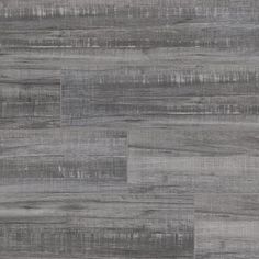 grey wood flooring that looks like it has been painted in different shades and sizes