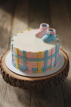 a cake with baby shoes on top of it