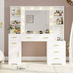 a white vanity with lights on it in a room