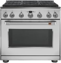 a stainless steel stove with four burners and two oven doors on the front side