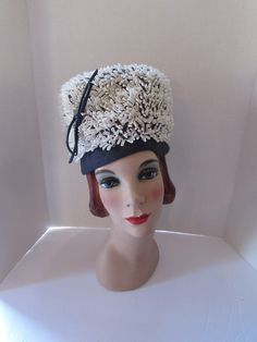 "SALE! 15% OFF! Most bubbly of all Bubble style hats from the '60s. Offered by Cain Sloan Company department store in Nashville.  The very high crown is formed by loops of white raffia-like tendrils.  It rests upon a 1 1/2\" navy shantung like brim/band. A shiny navy patent leather cord poses at right front.  Navy cording twines amongst the white loops.  If one looks at the inside of the hat it reveals a zig zag pattern to the cording.  (Note during its heyday, it would have been worn slightly b Bubble Style, Navy Fabric, Vintage Hat, Zig Zag Pattern, Nashville Tn, Hats Vintage, Department Store, Leather Cord, Zig Zag