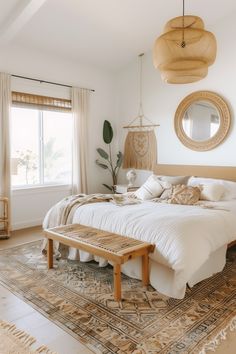 a large bed sitting in a bedroom next to a window