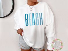 "Beach Sweatshirt, Cute Beach Sweatshirt, Vacation Sweatshirt, Swimsuit Coverup, Plus Size Beach Sweatshirt, Beach Life Gift for her ⭐ This item is MADE TO ORDER just for you! Our graphic sweatshirts are very soft, very cute and sure to keep you warm in the colder months. It's a pre-shrunk, classic fit sweater made with air-jet spun yarn for a soft feel. ------------------------------------------------------- S H I R T - D E T A I L S ------------------------------------------------------- The s Beach Sweatshirt, Plus Size Beach, Trendy Beach, Destin Florida, Sweatshirt Cute, Trendy Collection, Laguna Beach, Beach Shirts, Sweater Making