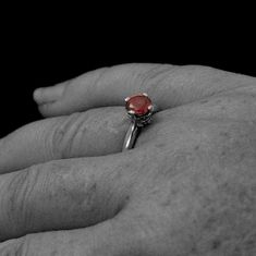 Ruby~July's Birthstone. It represents love, health and wisdom. And on this very special one of a kind ring it is paired with diamond accents and the cross. Faith, love, health and wisdom all in one! Small pave diamonds line the inner edges of the shank leading to the center where a heart and cross motif sport yet another small diamond. The cross, itself, forms each of the four prongs holding the center 6mm Chatham lab grown flawless ruby in place. Deb is a professional jeweler that has dedicated Heirloom Jewelry With Accent Stones For Proposal, Spiritual Promise Ring With Round Stone, Spiritual Style Promise Ring With Round Stone, Spiritual Round Stone Promise Rings, Sterling Silver Ruby Birthstone Ring For Proposal, Spiritual Sterling Silver Ruby Promise Ring, Spiritual Ruby Wedding Rings, Spiritual Ruby Rings For Weddings, Sterling Silver Ruby Ring For Proposal