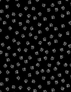 black and white dog paw prints on a dark background with space for text or image