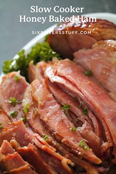 slow cooker honey baked ham on a plate with broccoli