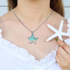 🌊💖 Embrace Coastal Elegance with Our Sand Starfish Necklace! 💖🌊 Hey there, beach babe! 🌴✨ Ready to adorn yourself with sandy serenity? Our Sand Starfish Necklace is your perfect companion for a touch of beach-inspired elegance and coastal charm. Imagine the soft sands under your feet, the gentle whisper of the ocean breeze, and the shimmer of sea treasures under the sun - that's the enchanting essence captured in this beautiful necklace. Whether you're dressing up for a special occasion or adding a bit of seaside sparkle to your everyday look, this necklace is a must-have for beach enthusiasts and ocean dreamers alike. Handcrafted with love and inspired by the serene beauty of the shore, each piece is a unique treasure that whispers of sandy beaches and tranquil tides. It's a delightf Star-shaped Ocean-inspired Necklaces For Beach, Star-shaped Necklaces For Beach Summer, Ocean-inspired Star Charm Jewelry For Beach, Ocean-inspired Beach Jewelry With Star Charm, Beachy Starfish Necklace Gift, Beachy Starfish Necklace For Gift, Ocean-inspired Star Shaped Jewelry For The Beach, Ocean-inspired Star Shaped Jewelry For Beach, Ocean-inspired Starfish Necklace For Beach