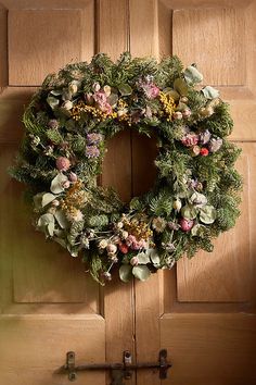 a wreath is hanging on the front door