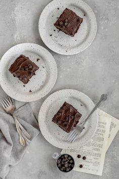 two white plates topped with brownies and chocolate chips