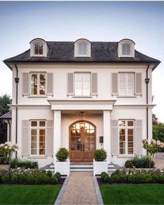 a large white house with two story windows