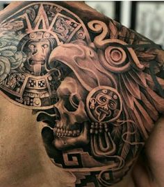 a man's back with tattoos on it and a clock in the middle of his chest