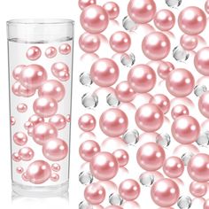 a glass filled with lots of pink pearls next to a tall vase full of white and silver balls