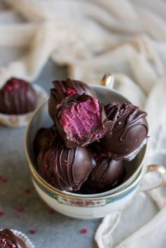 some chocolates are in a bowl on a table