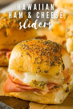 hawaiian ham and cheese sliders on a cutting board with text overlay that reads hawaiian ham and cheese sliders