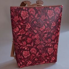 details Express yourself with our Red Vintage Floral backpack made from premium smooth vegan leather, with top zip closure, removable shoulder pad, adjustable straps with metal hardware, and a handle to hand-carry. Fits tablets or laptops up to 15". Interior: fully lined Dimensions: 13"L x 15.75"H x 5"D. Adjustable shoulder straps: 27" to 31" Our backpacks are handmade on demand to reduce waste from overproduction. Because of this, please allow us time to hand-make your backpack. Our backpacks are vegan and cruelty-free. Backpack Vintage, Vegan Leather Backpack, Floral Backpack, Shirts For Leggings, Red Vintage, Reduce Waste, Metal Hardware, Red Floral, Brown Gold