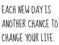 a black and white photo with the words each new day is another chance to change your life