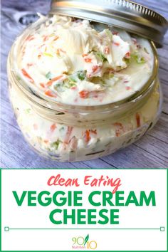 a jar filled with cream cheese sitting on top of a wooden table