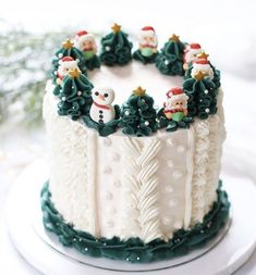 a decorated christmas cake sitting on top of a white plate