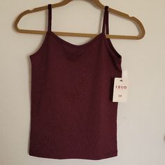 Izod Camisole/Tank Top New With Tags. X-Small. Deep Burgundy. Approximate Measurements: 14 1/2" From Hem To Top Of Body, 21" Hem To Top Of Strap, 14 1/4" Underarm To Underarm, Hem 13 1/2" Wide. Material: 92% Polyester, 8% Spandex. Machine Wash, Gentle Cycle. Very Soft And Nice Stretch. Smoke Free Home. Please Feel Free To Ask Questions Or Request Photos. Dark Red Tank Top, Red Seamless Camisole Top, Red Stretch Tank Top With Spaghetti Straps, Red Cotton Tank Camisole, Red Seamless Camisole Tank Top, Red Stretch Camisole Tank Top, Red Stretch Camisole With Tank Straps, Red Seamless Cami Top, Red Cami Tank Top With Built-in Bra