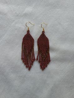 *All earring hooks are marked 925 sterling silver, the gold colored ones are gold plated silver*  The color of these earrings appear more red than they are in the photo. They are a deeper earthy red in person* These earrings are bright and eye catching making them a fun addition to any outfit or costume for a festival.     All of our earrings are hand selected directly from Indigenous artisans in Mexico, handmade with love and intention. Cultural Jewelry, Huichol Earrings, Springfield Mo, Seed Bead Earrings, Earring Hooks, Bead Earrings, Gold Plated Silver, Seed Bead, Beaded Earrings