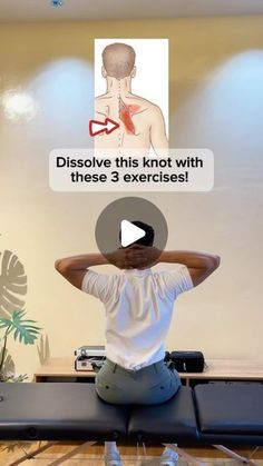 a man sitting on top of a yoga mat with his hands behind his head and back