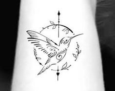 a small tattoo on the wrist with a bird flying over it and an arrow in the middle